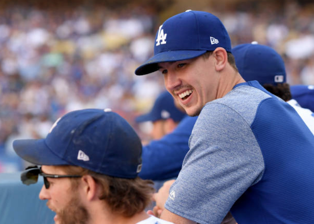 Los Angeles Dodgers pitchers Walker Buehler and Clayton Kershaw in the dugout at Dodger Stadium