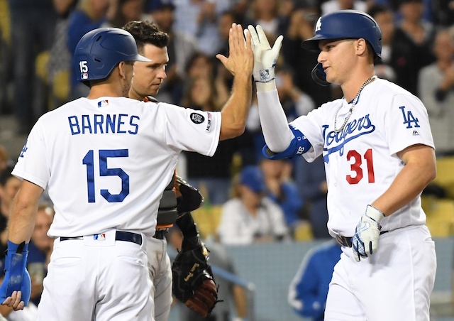 Los Angeles Dodgers catcher Austin Barnes celebrates with Joc Pederson after a home run against the San Francisco Giants