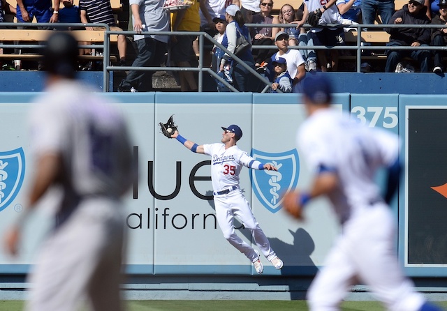 Los Angeles Dodgers right fielder Cody Bellinger makes a leaping catch at Dodger Stadium