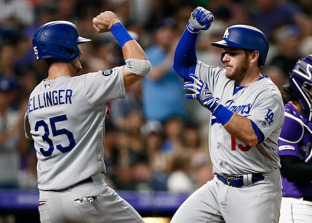 Los Angeles Dodgers teammates Cody Bellinger and Max Muncy celebrate after a home run against the Colorado Rockies