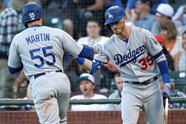 Los Angeles Dodgers first baseman Cody Bellinger congratulates Russell Martin