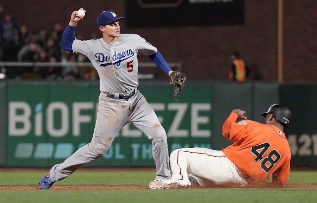 Los Angeles Dodgers shortstop Corey Seager turns a double play