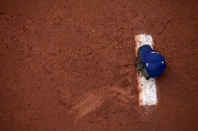 View of a Los Angeles Dodgers cap on the mound in the bullpen at Dodger Stadium