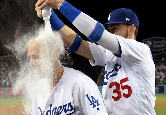 Los Angeles Dodgers teammates Cody Bellinger and Matt Beaty celebrate after a walk-off home run against the Colorado Rockies