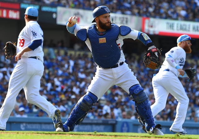 Los Angeles Dodgers Russell Martin, Hyun-Jin Ryu and Justin Turner play a sacrifice bunt