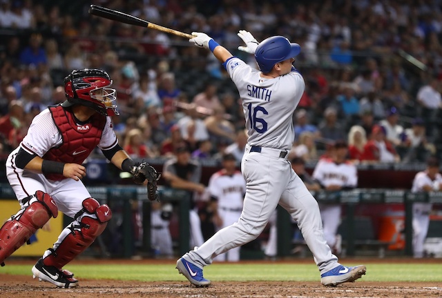 Los Angeles Dodgers catcher Will Smith hits a home run against the Arizona Diamondbacks