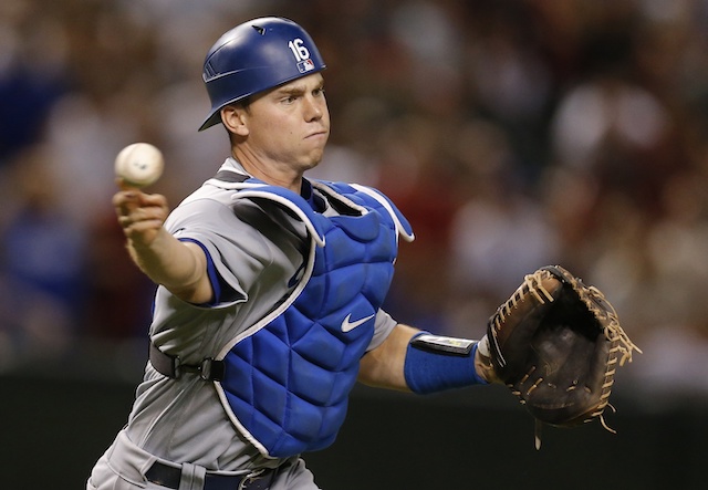 Los Angeles Dodgers catcher Will Smith makes a throw to first base