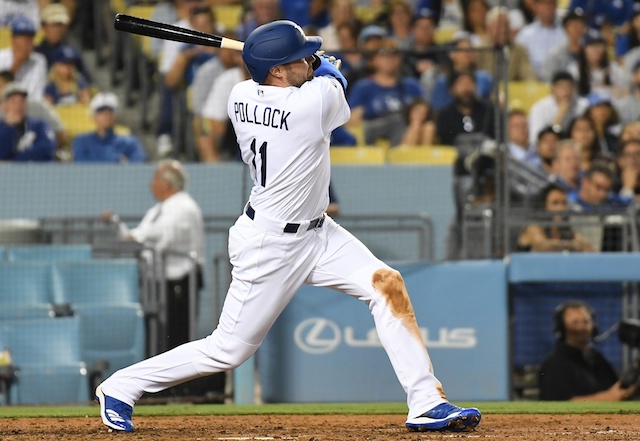 Los Angeles Dodgers center fielder A.J. Pollock hits a double against the Miami Marlins