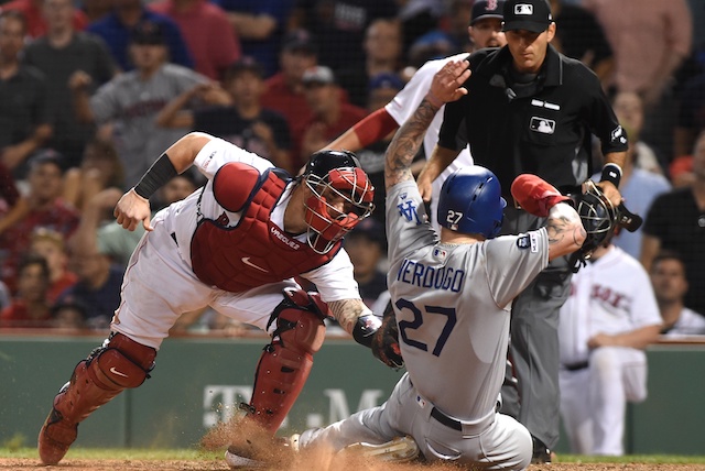 Los Angeles Dodgers outfielder Alex Verdugo is thrown out at home plate against the Boston Red Sox