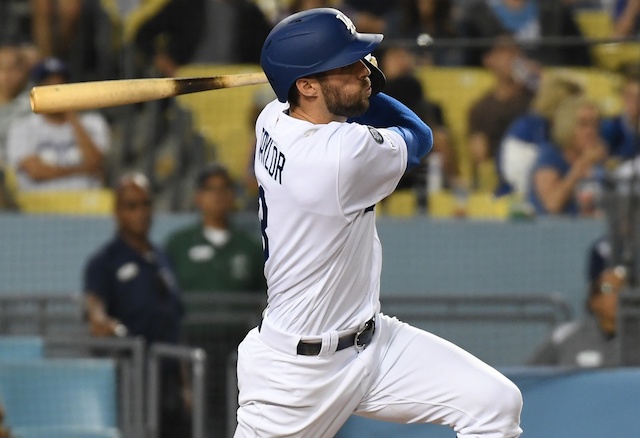 Los Angeles Dodgers shortstop Chris Taylor hits a triple against the Arizona Diamondbacks