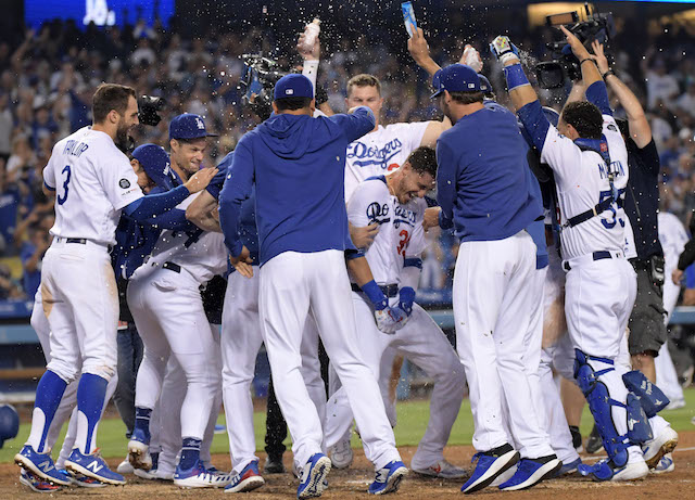 Cody Bellinger, Russell Martin, Joc Pederson, Corey Seager and Chris Taylor celebrate after a Los Angeles Dodgers walk-off win