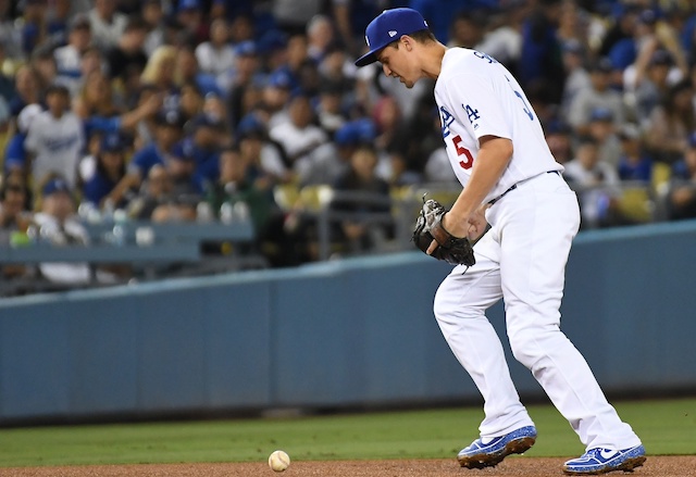 Los Angeles Dodgers shortstop Corey Seager commits an error against the Miami Marlins