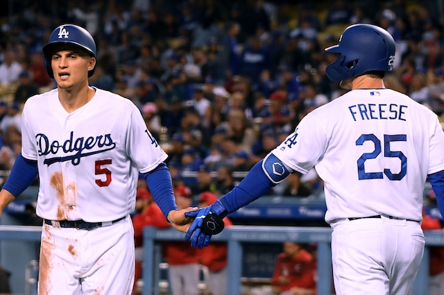 Los Angeles Dodgers teammates David Freese and Corey Seager celebrate during a game against the Cincinnati Reds