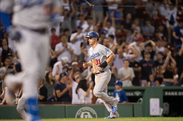 Los Angeles Dodgers outfielder Joc Pederson scores a run on a bases-loaded walk