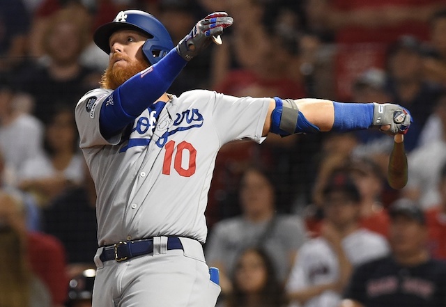 Los Angeles Dodgers third baseman Justin Turner hits a double against the Boston Red Sox