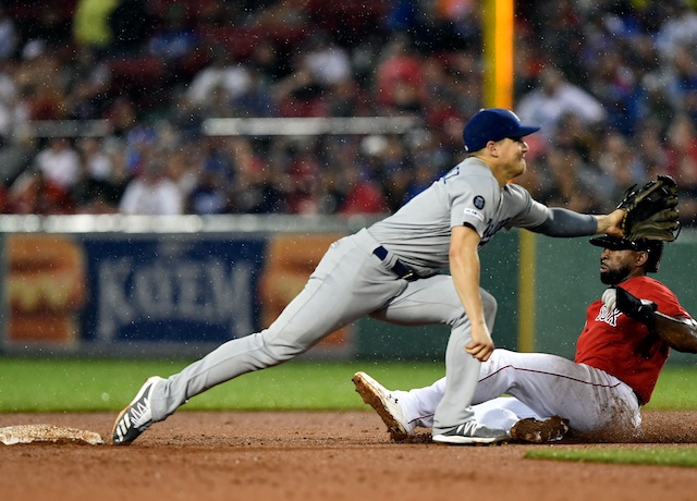 Los Angeles Dodgers second baseman Kiké Hernandez receives a throw against the Boston Red Sox