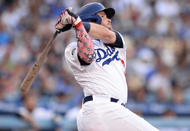 Los Angeles Dodgers second baseman Max Muncy hits a home run against the San Diego Padres