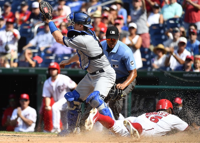 Los Angeles Dodgers catcher Will Smith receives a throw at home plate