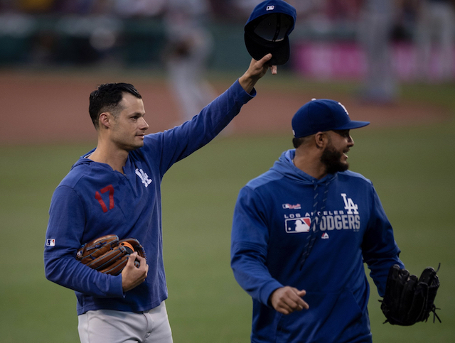 Los Angeles Dodgers relief pitcher Joe Kelly gestures to the crowd while walking out to the bullpen at Fenway Park