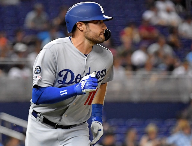 Los Angeles Dodgers center fielder A.J. Pollock hits a double against the Miami Marlins