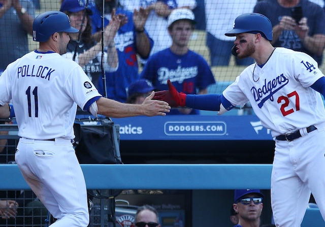 Los Angeles Dodgers outfielders A.J. Pollock and Alex Verdugo celebrate at Dodger Stadium