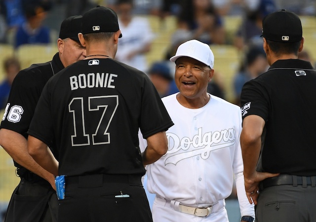 New York Yankees manager Aaron Boone and Los Angeles Dodgers manager Dave Roberts with umpires before a game at Dodger Stadium