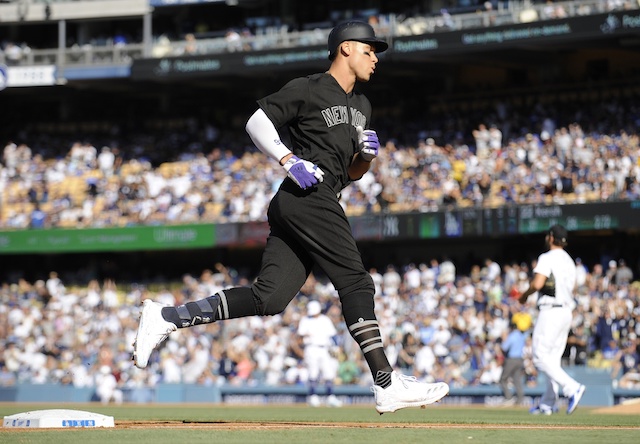 New York Yankees right fielder Aaron Judge rounds the bases after hitting a home run off Los Angeles Dodgers pitcher Clayton Kershaw