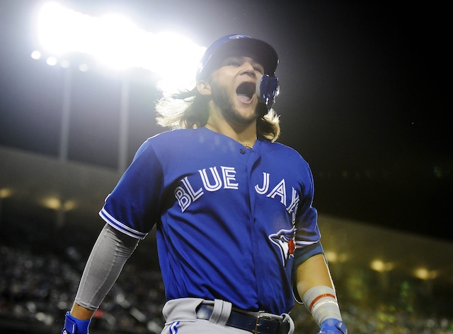 Toronto Blue Jays shortstop celebrates after hitting a home run off Los Angeles Dodgers pitcher Clayton Kershaw