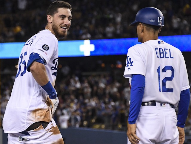 Los Angeles Dodgers All-Star Cody Bellinger reacts after his pants fall down during a game against the Toronto Blue Jays