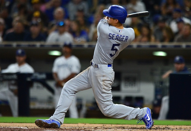 Los Angeles Dodgers shortstop Corey Seager hits a double against the San Diego Padres