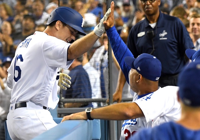 Los Angeles Dodgers manager Dave Roberts congratulates Will Smith after his grand slam against the San Diego Padres