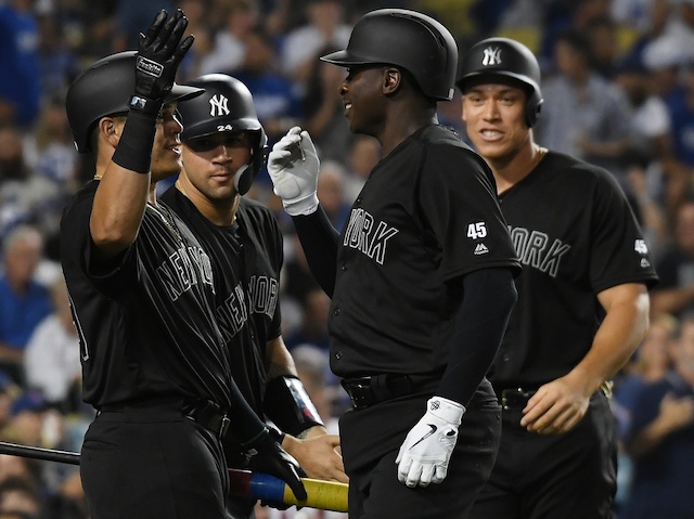 New York Yankees teammates DiDi Gregorious, Aaron Judge and Gary Sanchez celebrate after a grand slam