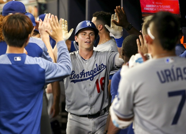 Will Smith is congratulated by Los Angeles Dodgers teammates after hitting a home run