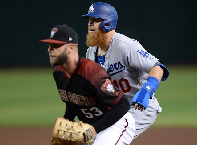 Los Angeles Dodgers third baseman Justin Turner leads off from first base