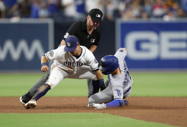 Los Angeles Dodgers utility player Kiké Hernandez steals second base against the San Diego Padres