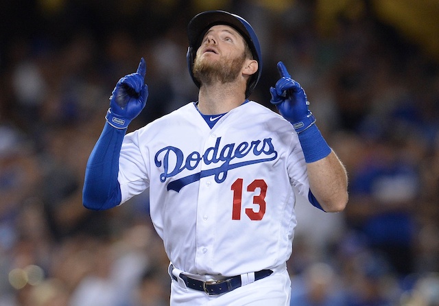 Los Angeles Dodgers infielder Max Muncy reacts after hitting a home run