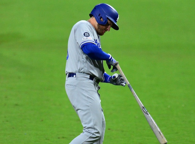 Los Angeles Dodgers infielder Max Muncy reacts after being hit by a pitch