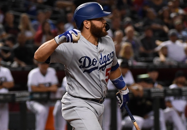 Los Angeles Dodgers catcher Russell Martin throws the ball back to Arizona Diamondbacks closer Archie Bradley