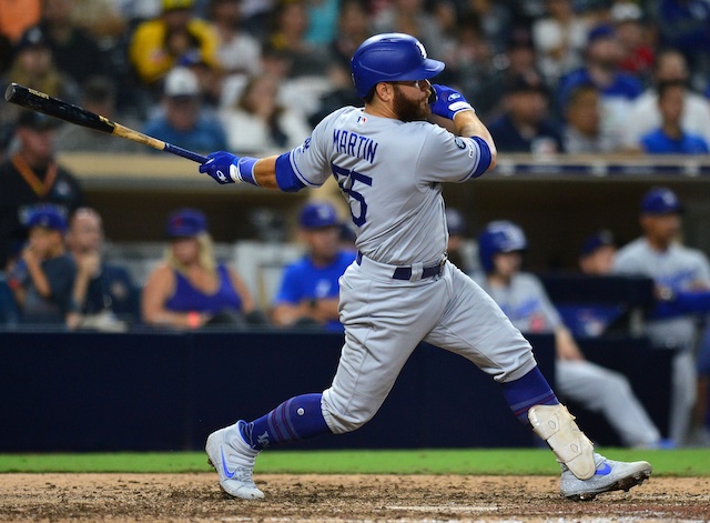 Los Angeles Dodgers catcher Russell Martin drives in a run against the San Diego Padres