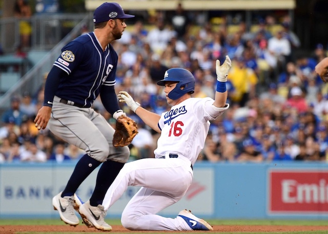 Los Angeles Dodgers catcher Will Smith slides into second base on a double