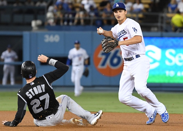 Los Angeles Dodgers shortstop Corey Seager completes a double play