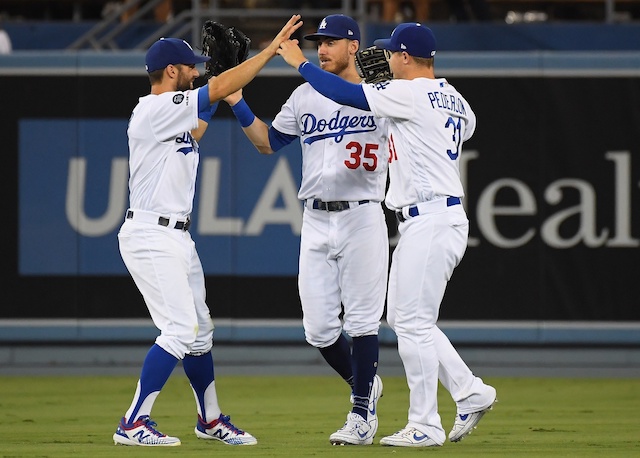 Cody Bellinger, Joc Pederson and Chris Taylor celebrate after a Los Angeles Dodgers win