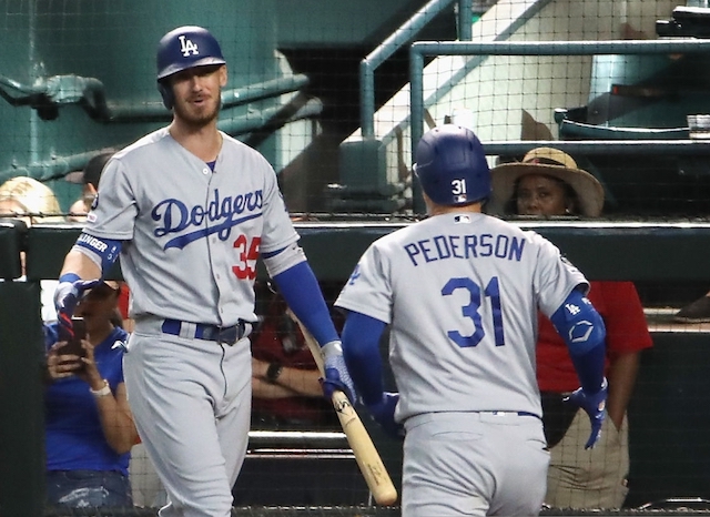 Los Angeles Dodgers teammates Cody Bellinger and Joc Pederson celebrate after a home run