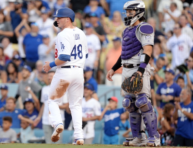 Los Angeles Dodgers infielder Gavin Lux scores a run against the Colorado Rockies