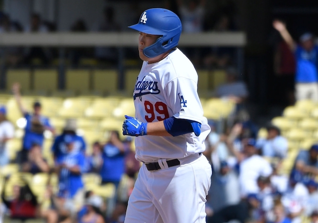 Los Angeles Dodgers starting pitcher Hyun-Jin Ryu rounds the bases after hitting his first career home run