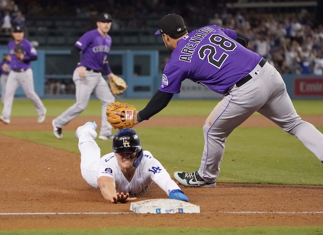 Los Angeles Dodgers utility player Kiké Hernandez slides into third base