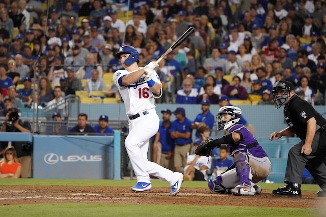 Los Angeles Dodgers catcher Will Smith hits an RBI infield single