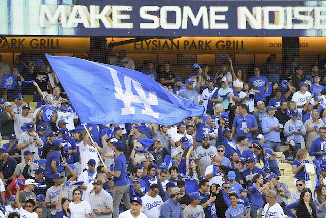 Los Angeles Dodgers fans with rally towels and a flag for the 2019 NLDS