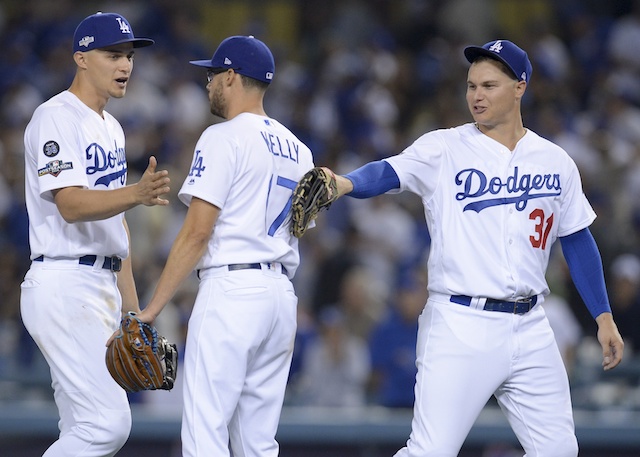 Los Angeles Dodgers teammates Joe Kelly, Joc Pederson and Corey Seager celebrate after winning Game 1 of the 2019 NLDS