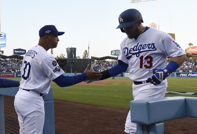 Los Angeles Dodgers manager Dave Roberts and Max Muncy celebrate after a home run during Game 5 of the 2019 NLDS